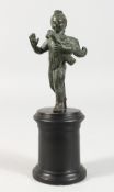 AN ANTIQUE BRONZE PUTTI on a stand.
