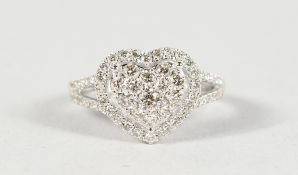 A GOOD 18CT GOLD AND DIAMOND HEART SHAPED RING.