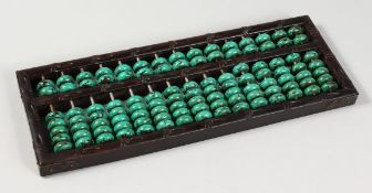 A CHINESE MALACHITE BEAD ABACUS. 14.5ins long.