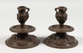 A GOOD PAIR OF 19TH CENTURY ITALIAN BRONZE CANDLESTICKS. on circular bases. 6ins high.