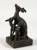 AN UNUSUAL CHINESE BRONZE SEAL MODELLED AS TWO DEER. 4.5ins high.