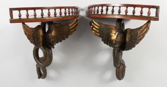 A GOOD UNUSUAL PAIR OF 19TH CENTURY MAHOGANY CORNER WALL SHELVES, the galleried tops supported by