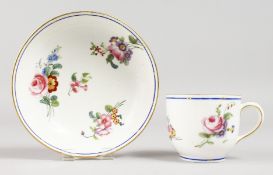 A SEVRES COFFEE CUP AND SAUCER, painted flowers under a blue line border, interlaced L's in blue,