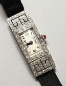 A LADIES ART DECO DIAMOND SET COCKTAIL WATCH.