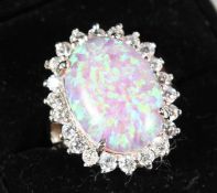 A SILVER AND GILSON OPAL DRESS RING.