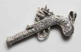 A CAST SILVER ANTIQUE PISTOL NOVELTY WHISTLE.