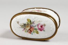 A FRENCH PORCELAIN DOUBLE-ENDED BOX, with gilt mounts and painted with flowers. 3ins long.