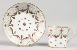 A GOOD SEVRES CUP AND SAUCER painted with garlands of roses. Mark in blue, Letters HH.