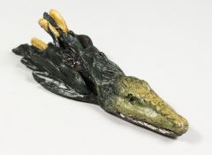A SMALL VIENNA STYLE COLD PAINTED BRONZE PAPER CLIP, modelled as a head of a crocodile. 5.5ins