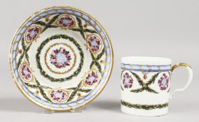 A GOOD SEVRES CUP AND SAUCER painted with roses. Mark in blue, No, 22.