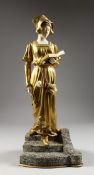 D. WATRIN A SUPERB ART DECO GILDED BRONZE AND IVORY FIGURE of a young lady reading a book and