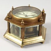 A BRASS HEXAGONAL TABLE CLOCK.