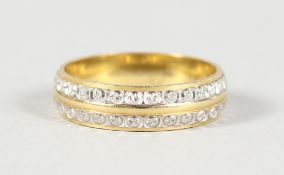 AN 18CT GOLD TWO-ROW DIAMOND ETERNITY RING.