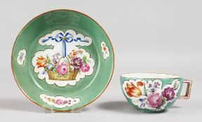 A GOOD MEISSEN GREEN GROUND CUP AND SAUCER painted with baskets of flowers. Mark in blue.