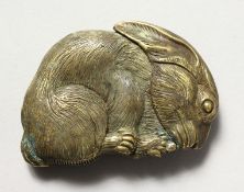 A BRASS RABBIT VESTA.