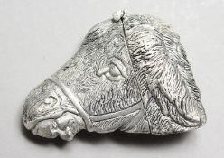 A DONKEY-HEAD SHAPE VESTA CASE.