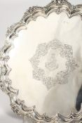 A SUPERB QUALITY VICTORIAN SALVER with cast border and crest EXPEDIER, on three claw and ball