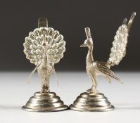A PAIR OF SILVER PEACOCK MENU HOLDERS.
