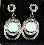 A PAIR OF SILVER AND OPAL DECO DESIGN DROP EARRINGS.
