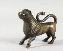 A SMALL EUROPEAN CAST BRONZE MODEL OF A STANDING LION, Possibly 12th Century, with traces of gilding