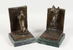 A PAIR OF BRONZE DACHSHUND BOOKENDS, on marble bases. 11ins high.