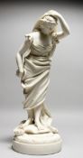 A 19TH CENTURY PARIAN FEMALE FIGURE, holding her head. 15ins high.