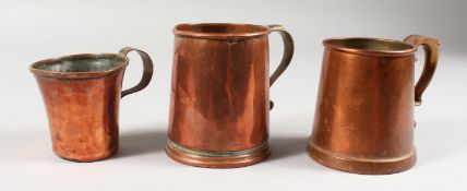 THREE EARLY COPPER MUGS.