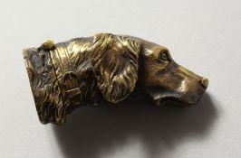 A BRASS DOG'S HEAD VESTA.