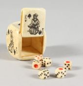 AN ETCHED BONE DICE.