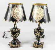 A PAIR OF TOLEWARE STYLE URN SHAPED TABLE LAMPS AND SHADES. 22ins high.