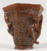 A CHINESE CARVED HORN LIBATION CUP. 5ins high.
