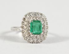 A 9CT GOLD, DIAMOND AND EMERALD CLUSTER RING