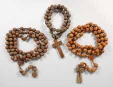 THREE CARVED ROSARIES.