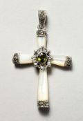 A SILVER, MOTHER-OF-PEARL AND PERIDOT CRUCIFIX SHAPE PENDANT.