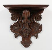 A CARVED OAK WALL BRACKET. 14.5ins high x 13.5ins wide x 6ins deep.