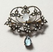 A 9CT GOLD AND SILVER, DIAMOND, BLUE TOPAZ AND PEARL BROOCH.