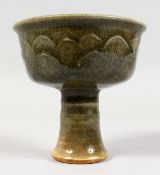 A CHINESE CELADON PORCELAIN STEM CUP. 4.25ins high.