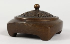 A SMALL CHINESE BRONZE CENSER WITH PIERCED LID. 3ins wide.
