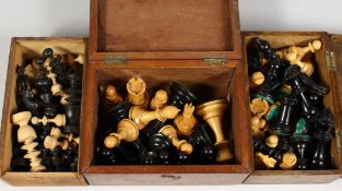 A QUANTITY OF CHESS PIECES in three boxes.