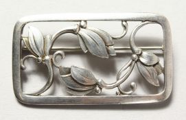 A GEORG JENSEN SILVER BROOCH.