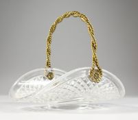 A GOOD CUT GLASS AND ORMOLU FLOWER BASKET, with swing handle. 10.5ins wide.