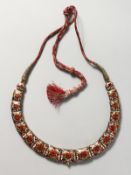 A SUPERB DIAMOND, RUBY AND ENAMEL NECKLACE.