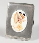 AN ENGINE TURNED SILVER CIGARETTE CASE, with an oval of a glamour model. Birmingham 1945.