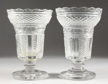 A GOOD PAIR OF HOBNAIL CUT PEDESTAL GLASS VASES ON CIRCULAR BASES. 8.5ins high.