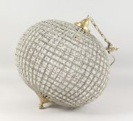 A LARGE CUT GLASS AND BRASS BALL SHAPE CHANDELIER. 24ins high.