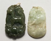 TWO CHINESE CARVED JADE PENDANTS WITH GOLD MOUNTS. 1.5ins high.