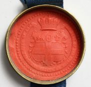 A ROYAL SEAL in a gilded box.