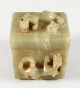 A JADE BOX AND COVER CARVED WITH LIZARDS. 3ins wide.