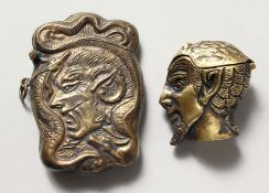 TWO BRASS DEVIL HEAD VESTAS.