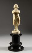 A VERY GOOD EUROPEAN CARVED IVORY FIGURE OF NAPOLEON. 7ins high.
